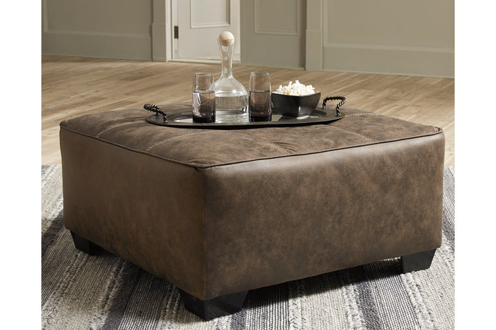 Ashley Furniture Abalone Square Oversized Accent Ottoman in Brown Faux Leather - Living room